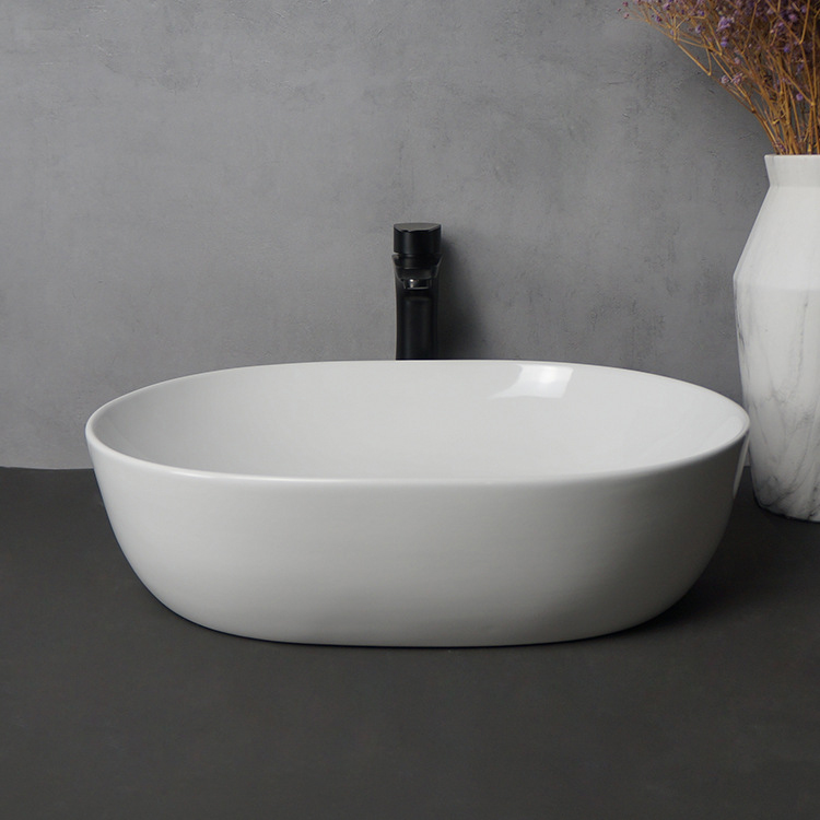 modern oval ceramic art wash basin above counter bathroom sink